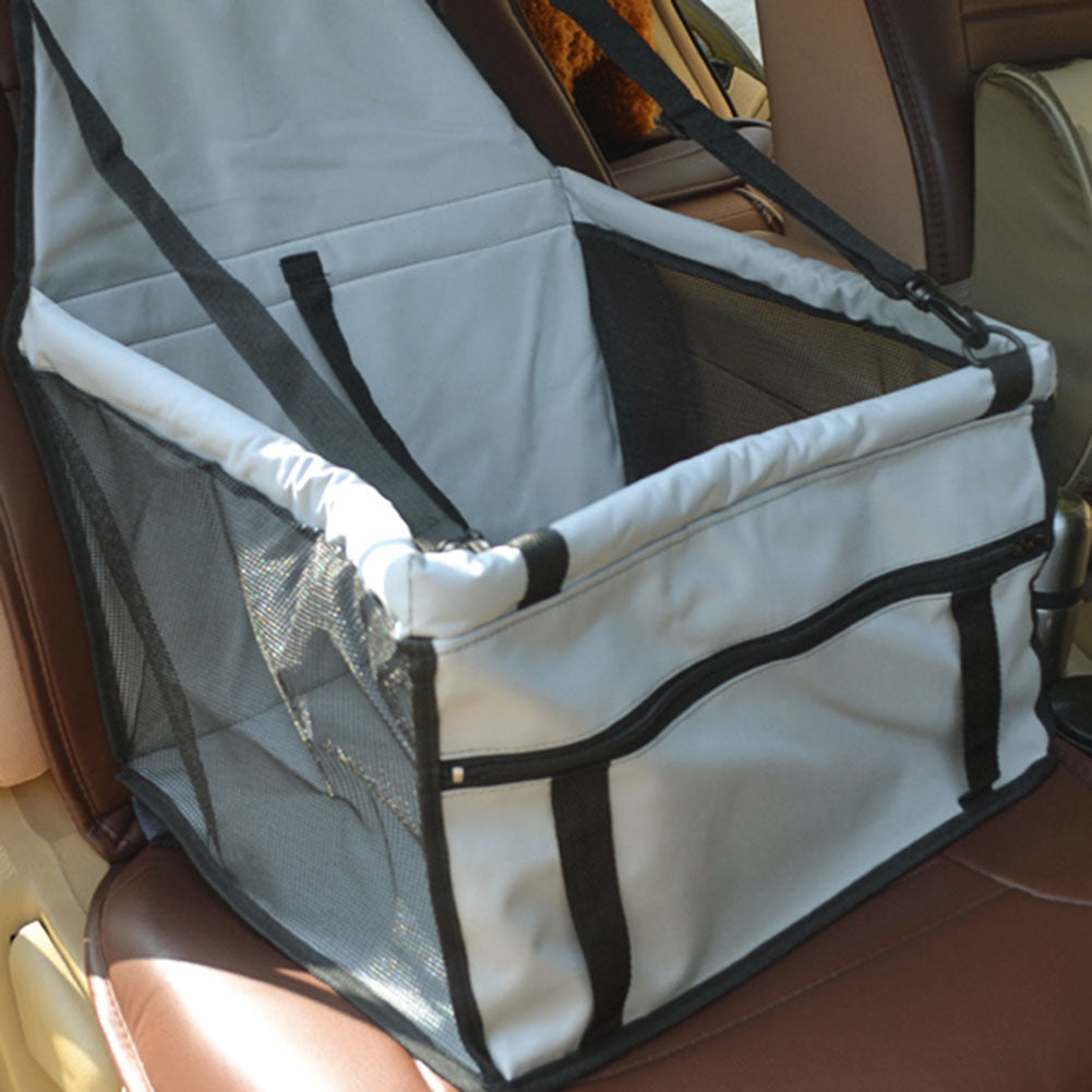 Waterproof and Foldable Car Booster Seat for Dogs with Clip-On Safety Leash and Storage Pocket.